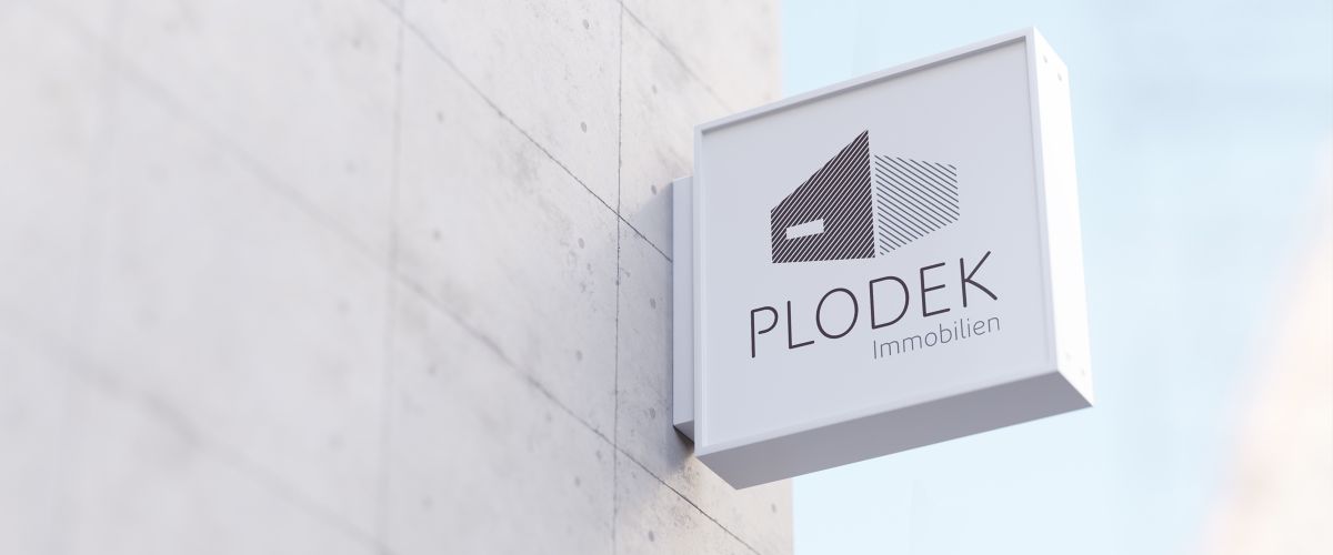 Logo-Design für Plodek Immobilien als Außenschild im neuen Corporate Design